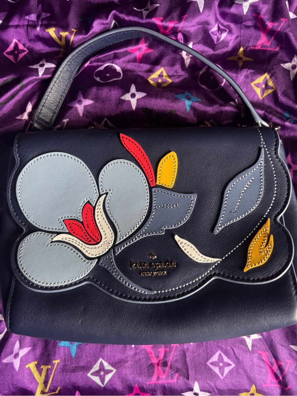 kate spade navy satchel with multicolor floral appliqué